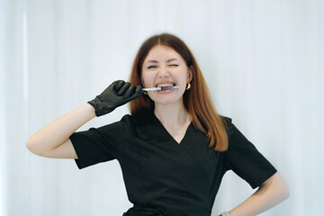 skilled aesthetician woman professional wearing black medical suit holding syringes