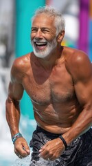 Fototapeta premium Happy senior man enjoying swimming pool in aqua park