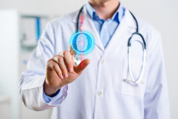 Doctor in lab coat touching a digital fingerprint scan with stethoscope hanging around neck