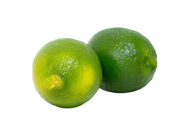 two limes sitting next to each other on a white surface