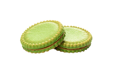 two green cookies are stacked on top of each other