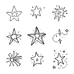 Fototapeta premium Hand-drawn doodle stars and sparkles set on white background