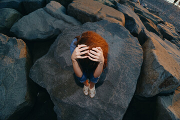 lifestyle woman with red curly hair in modern boho-western denim winter street style, film color,...