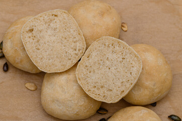 Wheat rolls cut in half, visible structure inside
