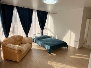 Bright Minimalist Bedroom Interior with Large Windows