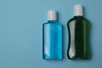 toothbrush, toothpaste, dental floss, tooth rinse on a blue background