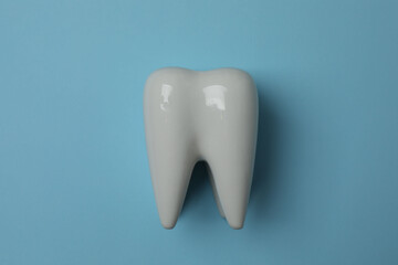 toothbrush, toothpaste, dental floss, tooth rinse on a blue background