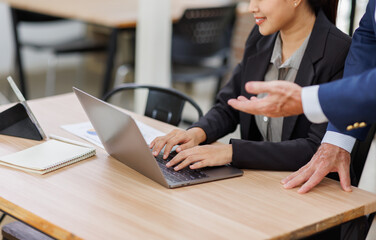 Happy two business people work.Business planning, office trainee, cooperate work with colleague,...