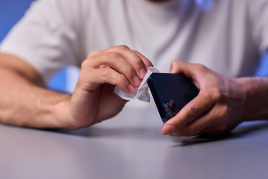 Cleaning a smartphone screen with a tissue needs attention for optimal hygiene and care