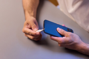 The Innovative Smartphone Cleaning Device is Being Demonstrated During Use and Functionality