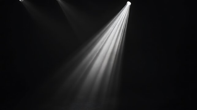 Stage lights illuminating a dark space (1)