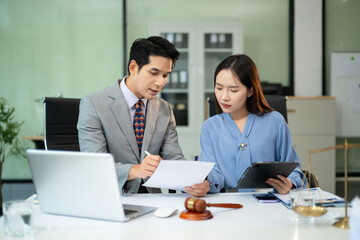 Professional female lawyers consulting on legal cases in office. Perfect for law, business,...