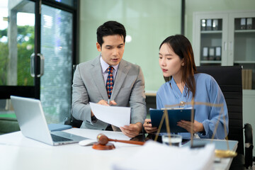 Professional female lawyers consulting on legal cases in office. Perfect for law, business,...