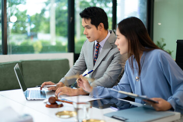 Professional female lawyers consulting on legal cases in office. Perfect for law, business,...
