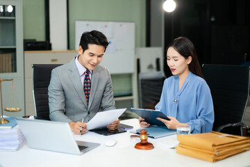 business people and lawyers discussing contract papers sitting at the table. Concepts of law,...
