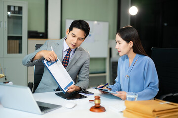business people and lawyers discussing contract papers sitting at the table. Concepts of law,...