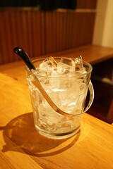 Close up glass bucket of ice cube