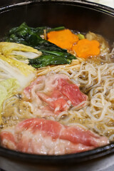 Close up beef and pork meat with mixed vegetables in Sukiyaki stove, Japanese hot pot
