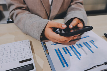 Entrepreneur Asian businessman and businesswoman discussing new business project in tablet in...