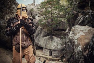 Post apocalyptic warrior standing in the cave settlement.