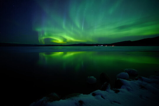 A beautiful sunset reflection on calm ocean water under a vast blue sky