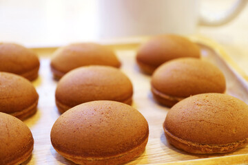 Delectable Homemade Mini Coffee Cakes on a Wooden Breadboard