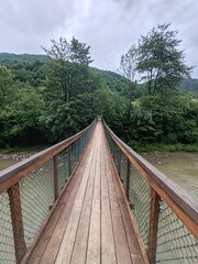 Fototapeta premium wooden bridge over the river