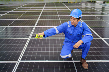 Electrical engineer inspecting and installing a solar panels on the building rooftop.