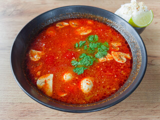 Spicy Thai soup Tom yum with shrimps and mushrooms