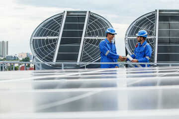 System engineer inspects an air ventilator system building rooftop.
