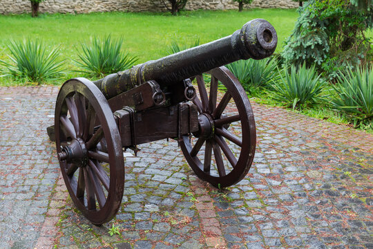 Medieval field cannon on wheeled carriage on old castle territory