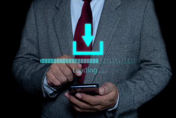 Businessman use smartphone to download or installing software on laptop computer, cloud storage technology, data backup, cyber security, document downloading