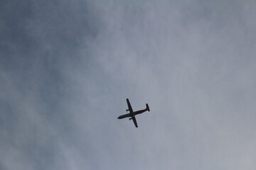 The blue and calm sky with the airplane flying