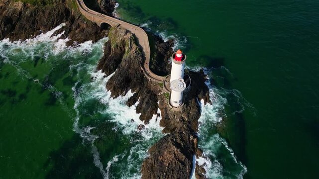 Beautiful panoramic backwards drone movement over the Petit Minou lighthouse aka Phare du Petit Minou in Plouzan&eacute;, Finist&egrave;re, Brittany, France.