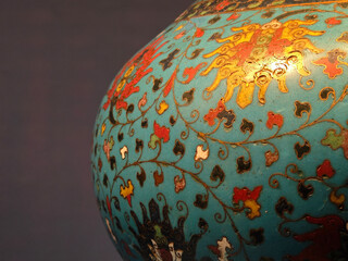  close view to the surface of colorful vase under bright light in the museum for show
