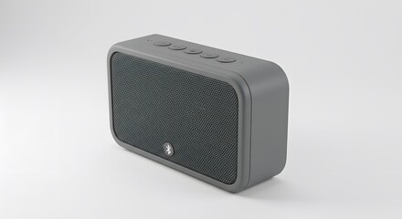 Obraz premium Gray Bluetooth speaker with button controls on a white surface