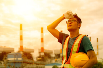 Hot tired worker working outdoor sweating feel over heat in hot day summer sun burning dehydration