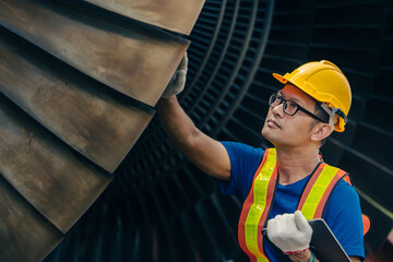 Professional Asian engineer male working service power plant turbine fan blade electrical generator