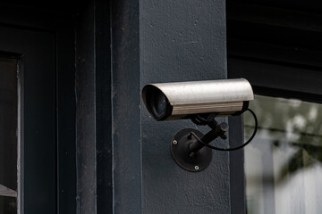 Security camera mounted on building exterior