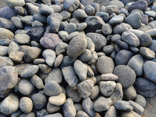 Seamless background ot texture made of gray pebbles