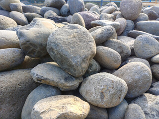 Seamless background ot texture made of gray pebbles