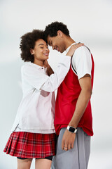 Young couple sharing joyful moments in a stylish and modern space filled with love