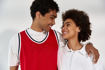 Young couple sharing a sweet moment full of love and style in a minimalist setting