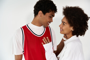 Young couple sharing a warm moment in a stylish indoor setting filled with love and joy