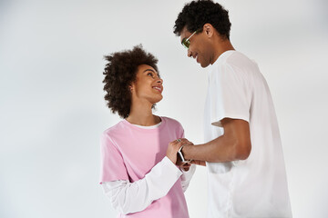 Young couple enjoying a moment of love and connection in a stylish studio setting