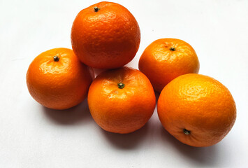 Delicious and Nutritious Orange Fruits on White