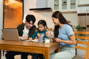 Family Asian spending happy time together on vacation, sitting in the kitchen.