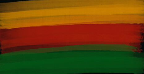 Abstract paint brush textured stripes in traditional African colors red, yellow green on black background. Black history month brush color background, african flag colors, icon of african american