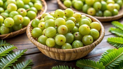 Basket of fresh green indian gooseberries on a wooden table