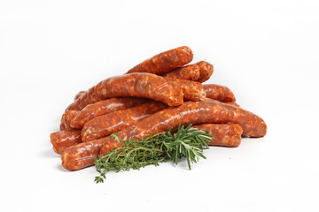 Group of raw merguez sausages on a white background